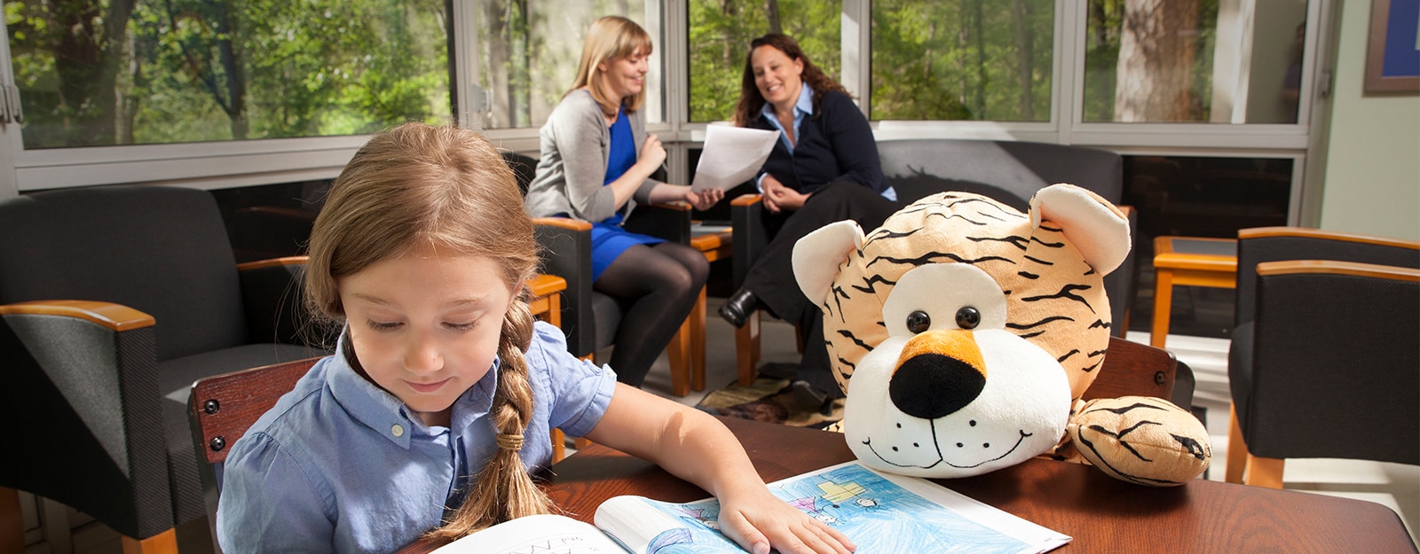 girl coloring at table