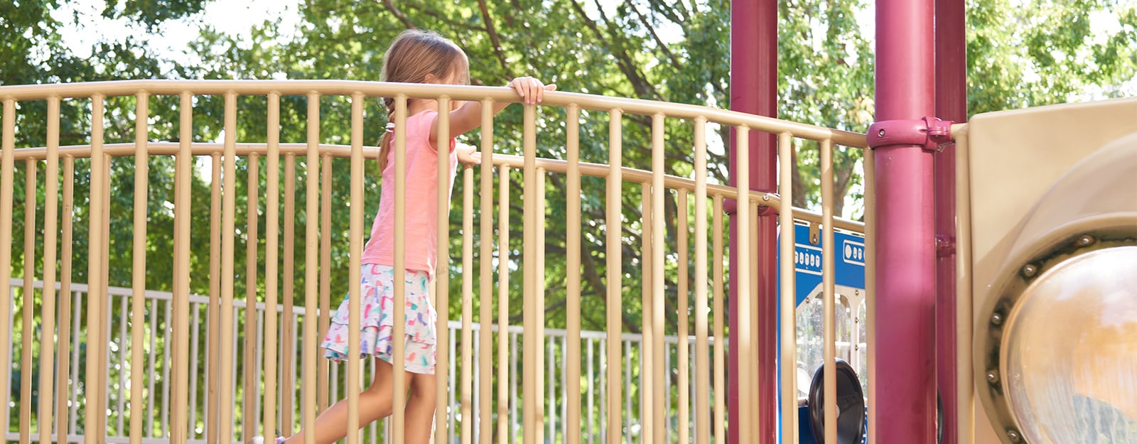 girl playing on playset at marcus autism center