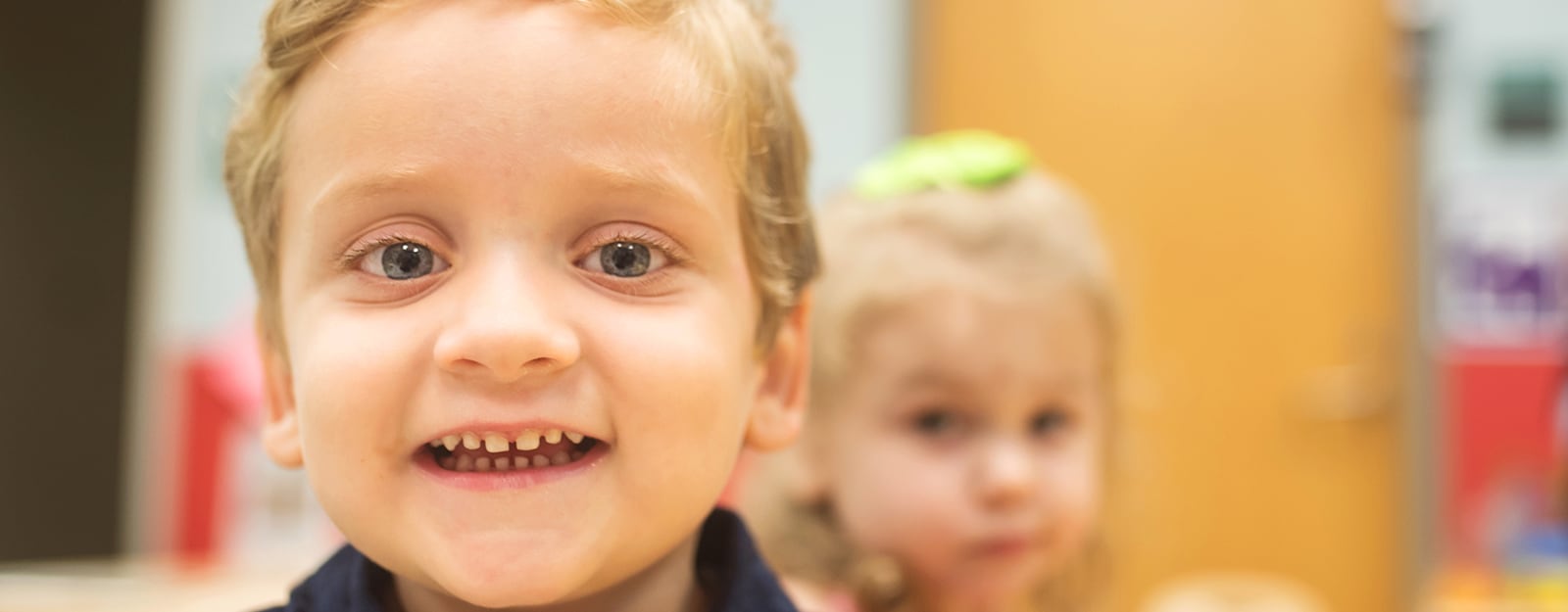 boy smiling in classroom