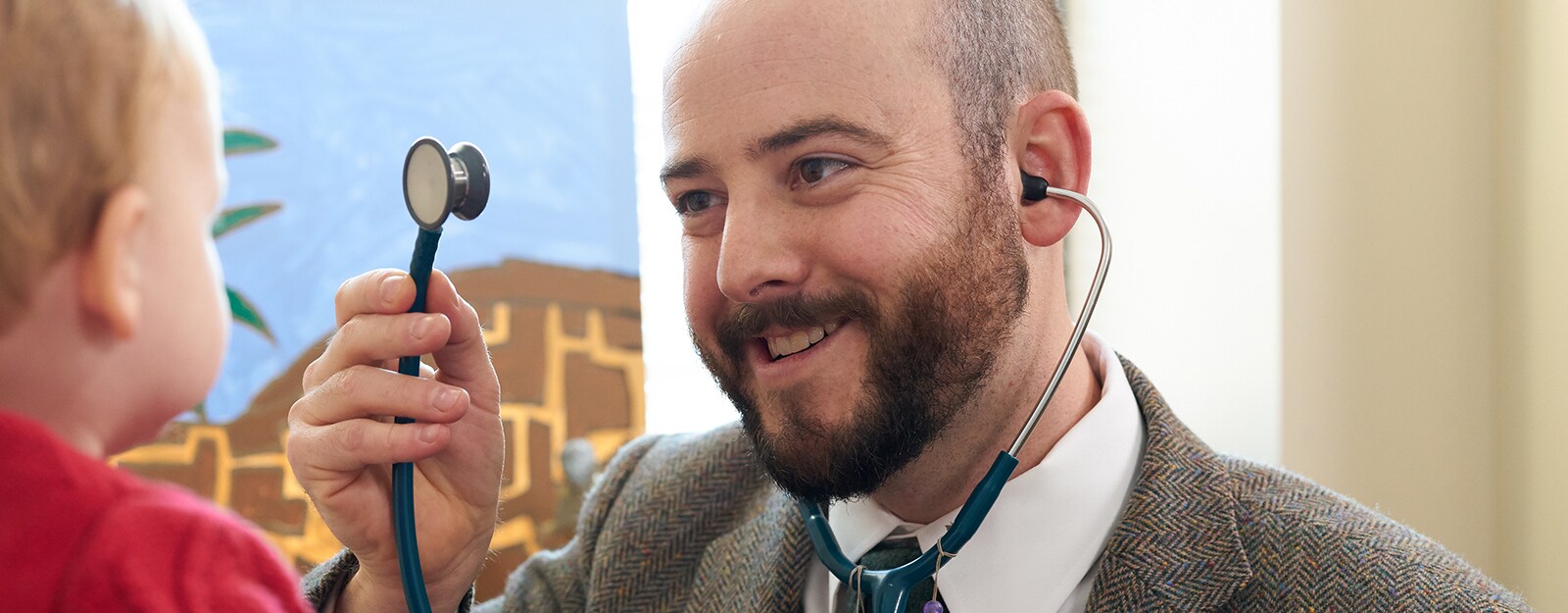 medical provider at marcus autism center showing baby stethescope
