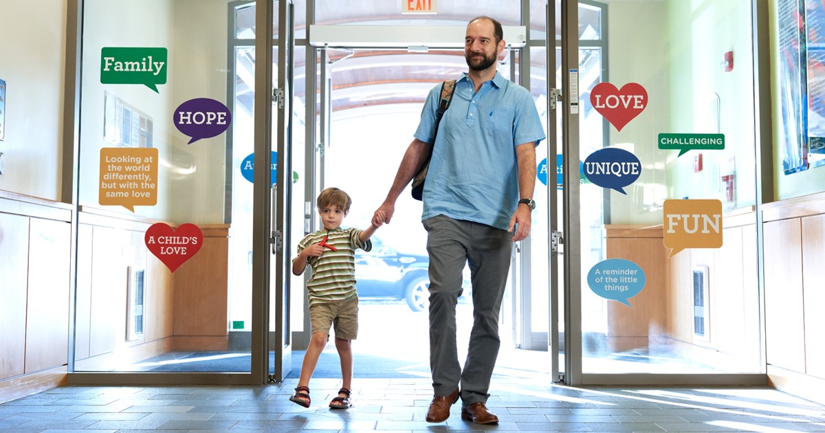 father and son walking into marcus autism center