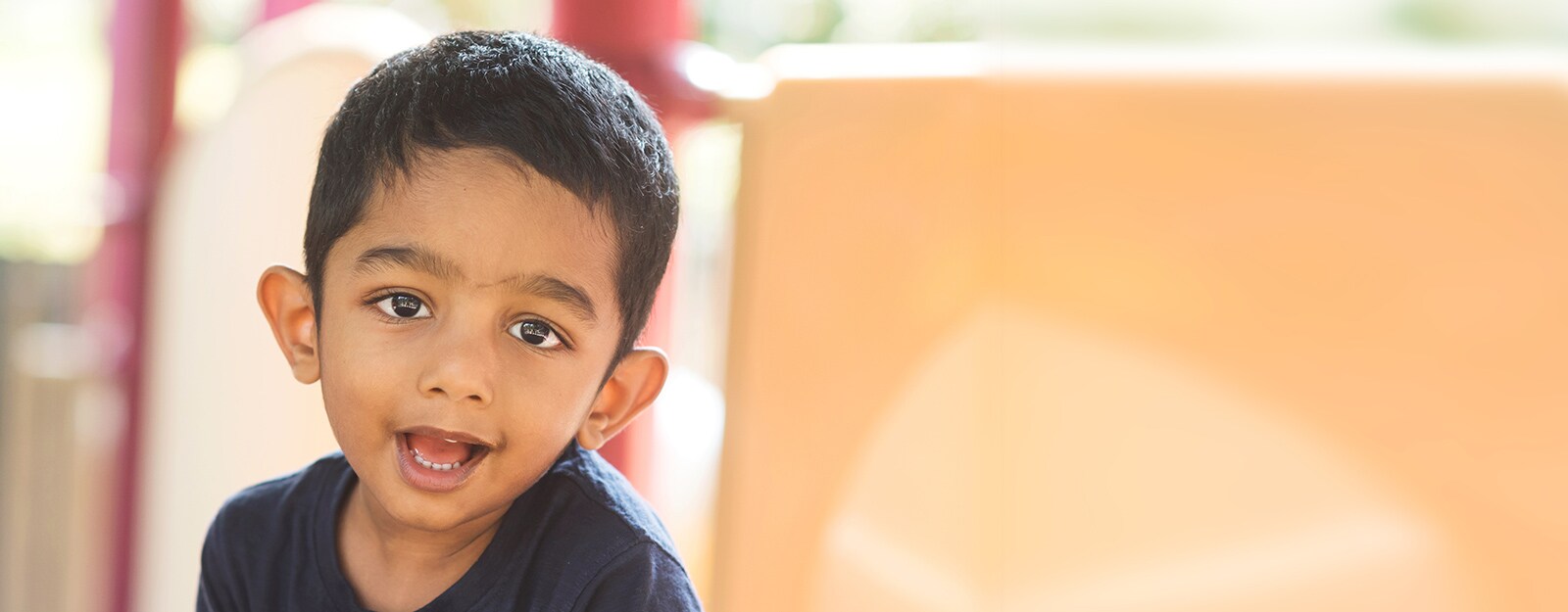 boy smiling on playground