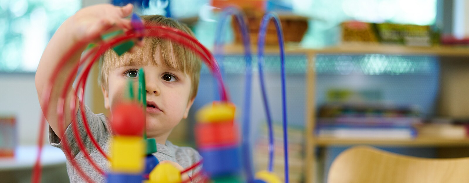 boy at marcus autism center playing with toys