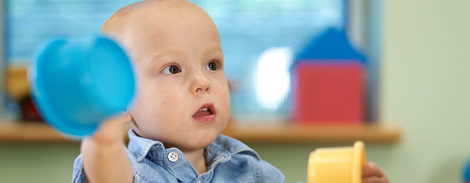 boy at Marcus autism center with toy 