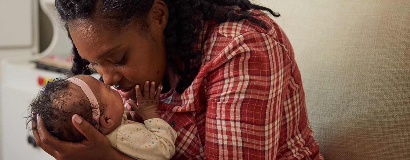 mother holding newborn in arms