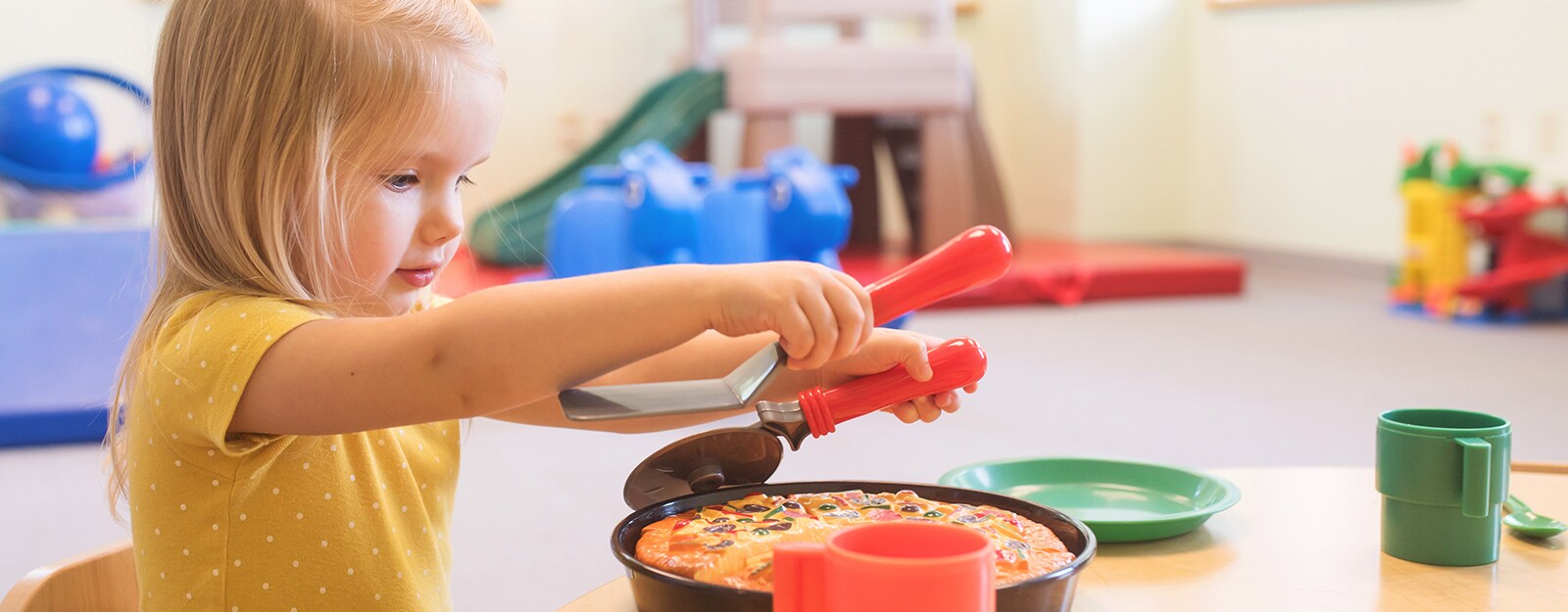 girl playing with food at marcus autism center