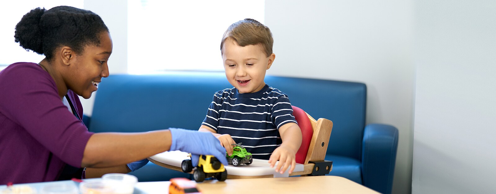 Boy playing with trucks 