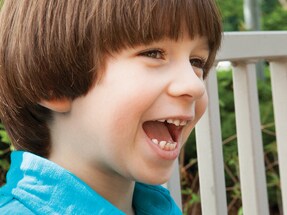 Marcus autism boy smiling on playground